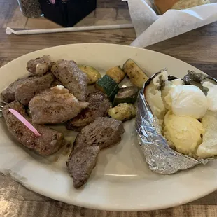 The steak trimmings plate with baked tater. Seasoning was very tasty. Perfect medium rare and delicious!