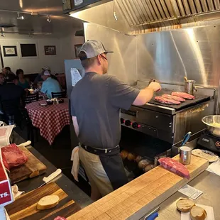 a man cooking in a commercial kitchen