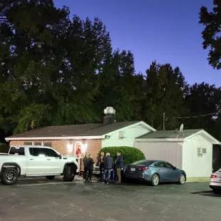 a group of cars parked in a parking lot