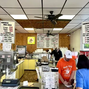 Ordering &amp; paying, fresh slicing of beef, sandwich construction, and tray organization, all in this area