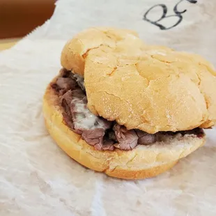 a sandwich on a piece of wax paper