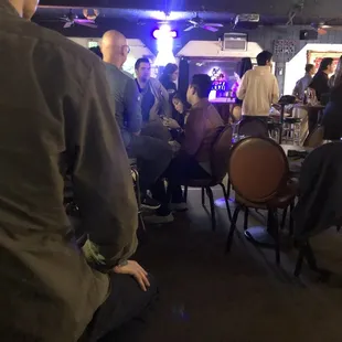 a group of people sitting at a table