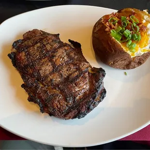 14-ounce ribeye (Pittsburgh style) and a loaded baked potato