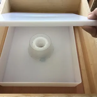 a candle in a wooden box