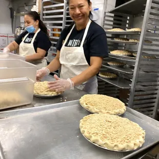 Apple pies getting prepped