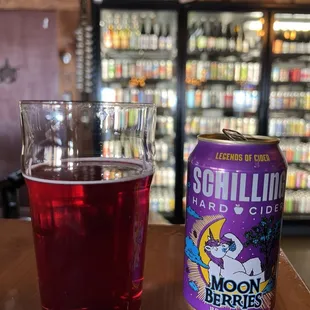 a glass and a can of beer