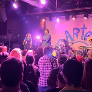 a band performing on stage