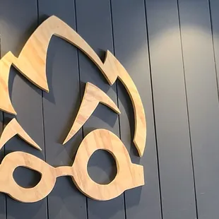 Inside above the bar. Their logo.