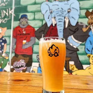 a glass of beer on a table