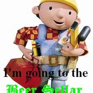 a man in overalls holding a toolbox