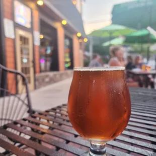 a glass of beer on a table
