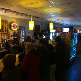 a crowd of people at a bar