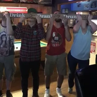 a group of people holding up a sign