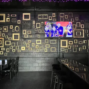 a bar with a large screen