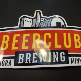 BeerClub sticker w hanging light reflection