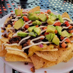 "Small" loaded nachos. A solid meal portion for one, or a nice side dish for 2-3.  Delicious!