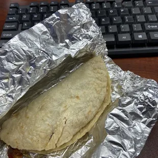 a burrito wrapped in tin foil