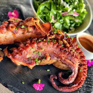 The amazing octopus is braised in white Rioja wine before finishing on the grill