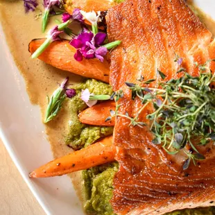 Fjord Salmon - Norwegian Fjord salmon filet, broccolini puree, sautéed baby carrots, lemon beurre blanc.