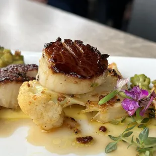 Scallops - seared, Spanish chorizo, cauliflower, romanesco, toasted almonds, mango citrus sauce, truffle oil.