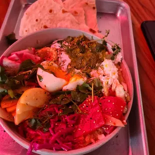 a bowl of food on a tray