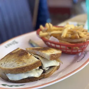 a grilled cheese sandwich and french fries