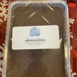 a chocolate cake in a plastic container