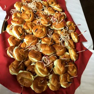 a platter of mini sandwiches