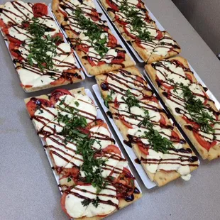 four slices of flatbread pizza