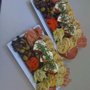 two platters of appetizers
