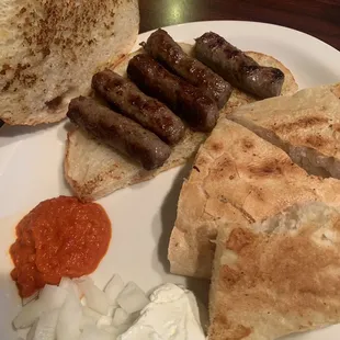 Kid's Cevapi (grilled sausages, fresh homemade bread, onions, condiments)