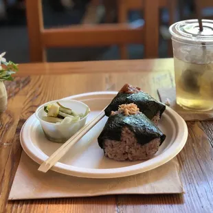Salmon rice ball and Ume rice ball with a side of pickled cabbage. Drink is iced hojicha.