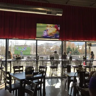 The tap room with big screen tv, looking out onto the patio