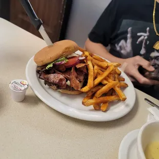 a plate of fries and a sandwich