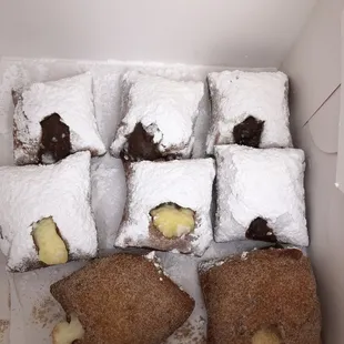 Cinnabon, vanilla, chocolate and spiced hot chocolate filled beignets