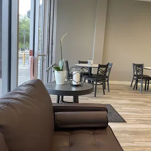 a view of a dining room with a table and chairs