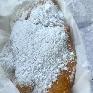 Beignets - order of 3. Shown is ONE beignet. These things are huge. You can also get an order of 9 bite sized beignets.
