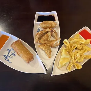 three plates of food on a table