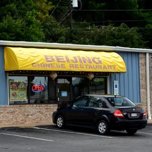 a car parked in front of the restaurant