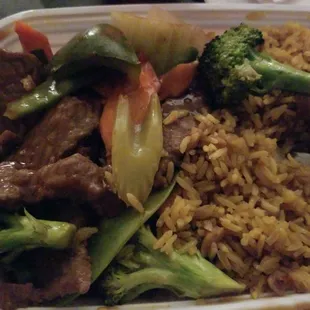 beef, broccoli, and rice in a styrofoam container