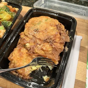 two trays of chicken and broccoli