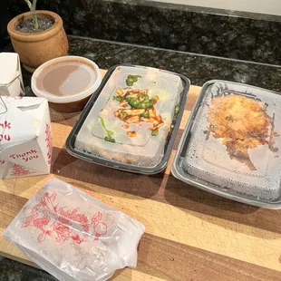 three trays of food on a counter