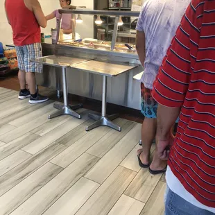 a group of people standing around a counter