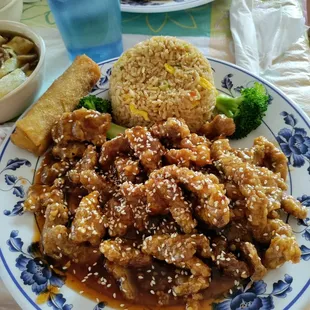 Sesame beef dinner, comes with fried rice or steamed, and either an egg roll or cream cheese Rangoon.