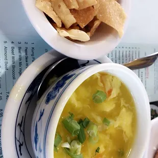 a bowl of soup and a bowl of tortillas