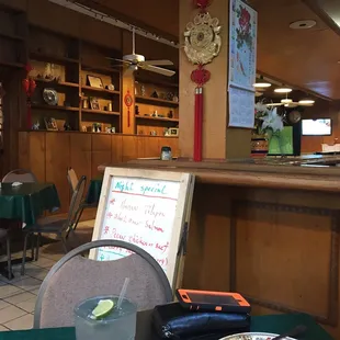 a person sitting at a table in a restaurant