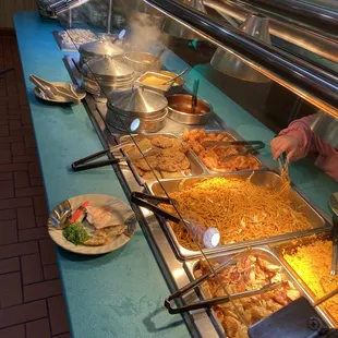 a buffet with a variety of food items