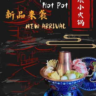 an oriental teapot with various foods in it