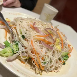 a plate of noodles and vegetables