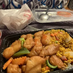 a tray of chicken and rice